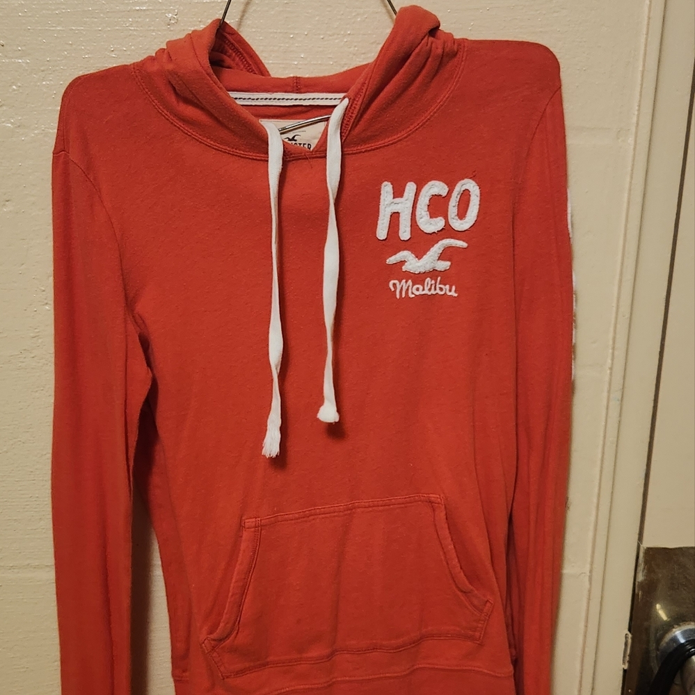 Orange hollister hoodie size medium